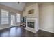 Living room showcasing a cozy fireplace and large windows providing natural light at 27 Spring Folly Nw, Cartersville, GA 30121