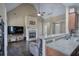Open concept living room includes fireplace, bar top, and dark hardwood flooring at 27 Spring Folly Nw, Cartersville, GA 30121