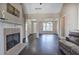 Cozy living area with hardwood floors, fireplace, and view into the dining area at 27 Spring Folly Nw, Cartersville, GA 30121