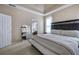 Carpeted main bedroom with a tray ceiling and dark furniture set at 27 Spring Folly Nw, Cartersville, GA 30121