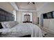 Carpeted main bedroom with a tray ceiling and television at 27 Spring Folly Nw, Cartersville, GA 30121
