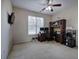 Bright room with modern ceiling fan and dedicated office space with built-in shelving at 27 Spring Folly Nw, Cartersville, GA 30121
