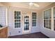 Covered patio offers an enjoyable outdoor space with view to fenced backyard at 27 Spring Folly Nw, Cartersville, GA 30121