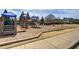 Community playground featuring colorful slides, climbing structures, and swings, providing a safe and fun recreational area at 27 Spring Folly Nw, Cartersville, GA 30121