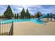 Community pool with slide and lounging deck, providing a refreshing and recreational space for residents and guests at 27 Spring Folly Nw, Cartersville, GA 30121