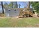 Backyard featuring new deck, walkout basement and new wooden privacy fence at 4985 Crowe Se Dr, Smyrna, GA 30082