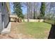 View of the spacious, well-maintained backyard with a wooden fence at 4985 Crowe Se Dr, Smyrna, GA 30082