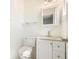 Bright bathroom featuring white vanity, granite countertop, and updated fixtures at 4985 Crowe Se Dr, Smyrna, GA 30082