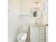 Bright bathroom with white fixtures, vanity with storage, and updated lighting at 4985 Crowe Se Dr, Smyrna, GA 30082