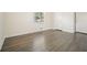 Bedroom with wood flooring, closet doors, and natural light from the window at 4985 Crowe Se Dr, Smyrna, GA 30082