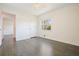 Bedroom with hardwood floors, window, ceiling fan, and access to hallway at 4985 Crowe Se Dr, Smyrna, GA 30082