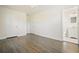 Bedroom with wood flooring, closet doors, and access to bathroom at 4985 Crowe Se Dr, Smyrna, GA 30082