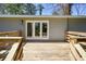 Wooden deck with access to the home through glass doors, overlooking yard at 4985 Crowe Se Dr, Smyrna, GA 30082