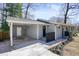 Charming single-story home with grey siding, covered carport and black trim at 4985 Crowe Se Dr, Smyrna, GA 30082
