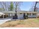 Charming single-story home with gray brick, black shutters, and a cozy front porch at 4985 Crowe Se Dr, Smyrna, GA 30082