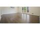 Bright living room with hardwood floors and access to outdoor space via French doors at 4985 Crowe Se Dr, Smyrna, GA 30082