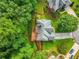 Aerial view features a backyard and deck area that offers a peaceful outdoor retreat at 5425 Edinbourgh Ct, Cumming, GA 30040