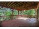 Wide view of spacious back deck surrounded by lush greenery, great for relaxing at 5425 Edinbourgh Ct, Cumming, GA 30040