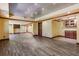 Spacious basement with wood-look floors, recessed lighting, and open layout at 5425 Edinbourgh Ct, Cumming, GA 30040