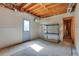 Unfinished basement with exposed ceiling, concrete floor, and walkout access at 5425 Edinbourgh Ct, Cumming, GA 30040