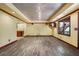 Finished basement with wood-look floors, recessed lighting, and an open floorplan at 5425 Edinbourgh Ct, Cumming, GA 30040
