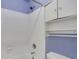 Bathroom featuring a white tub, shower, and white cabinets for storage at 5425 Edinbourgh Ct, Cumming, GA 30040