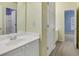 Bathroom with blue accent wall, shower, and open door at 5425 Edinbourgh Ct, Cumming, GA 30040