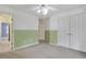 Bright bedroom featuring neutral carpet, a ceiling fan, and closet at 5425 Edinbourgh Ct, Cumming, GA 30040