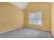 Bedroom featuring neutral carpet, vaulted ceilings, and plantation shutters at 5425 Edinbourgh Ct, Cumming, GA 30040