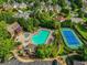An aerial view shows the community pool, tennis courts, and clubhouse at 5425 Edinbourgh Ct, Cumming, GA 30040