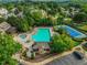 An aerial view shows the community pool, tennis courts, and clubhouse at 5425 Edinbourgh Ct, Cumming, GA 30040