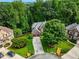 Lovely brick home nestled among lush trees and greenery in a quiet cul-de-sac at 5425 Edinbourgh Ct, Cumming, GA 30040