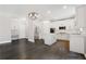 Modern renovated kitchen with stainless appliances, large island, desk area and hardwood floors at 5425 Edinbourgh Ct, Cumming, GA 30040