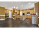 Eat-in kitchen with wood cabinets, kitchen island, stainless appliances and view to the backyard at 5425 Edinbourgh Ct, Cumming, GA 30040