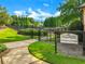 Castlebrooke Tennis Center entrance with well-maintained courts and manicured landscaping under a blue sky at 5425 Edinbourgh Ct, Cumming, GA 30040