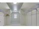 Spacious walk-in closet with ample shelving and storage space at 5425 Edinbourgh Ct, Cumming, GA 30040