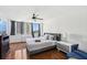 Sunlit bedroom with large windows, hardwood floors, and a stylish ceiling fan at 215 Piedmont Ne Ave # 2109, Atlanta, GA 30308