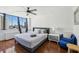Bright bedroom featuring a city view from a large picture window at 215 Piedmont Ne Ave # 2109, Atlanta, GA 30308