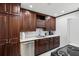 Well-equipped kitchen with dark wood cabinets, stainless steel appliances, and ample counter space at 215 Piedmont Ne Ave # 2109, Atlanta, GA 30308