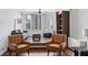 Bright and airy living room with city views, hardwood floors, and stylish furniture at 215 Piedmont Ne Ave # 2109, Atlanta, GA 30308