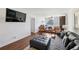 A spacious living room with hardwood floors, comfortable seating, and views of the city skyline at 215 Piedmont Ne Ave # 2109, Atlanta, GA 30308
