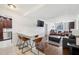 Bright living room features a breakfast bar, stainless steel appliances, and an open layout at 215 Piedmont Ne Ave # 2109, Atlanta, GA 30308