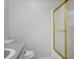 Bright bathroom features the toilet and the tub with a gold framed glass door at 3505 Miller St # D, Lithia Springs, GA 30122
