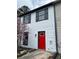 A townhouse with gray shutters and a vibrant red front door at 3505 Miller St # D, Lithia Springs, GA 30122
