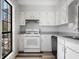 Well-maintained kitchen featuring white appliances and ample cabinet space at 3505 Miller St # D, Lithia Springs, GA 30122