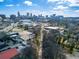 An aerial view of the city skyline with bare trees and industrial buildings visible in the foreground at 578 Cedar Avenue, Atlanta, GA 30318