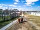 An aerial view of the path with rusty tanks, a building, trees and cloudy skies at 578 Cedar Avenue, Atlanta, GA 30318