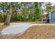 The spacious backyard offers a large gravel area, and lush foliage at 578 Cedar Avenue, Atlanta, GA 30318