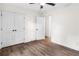 Bedroom with wood-look floors and a large closet with double doors at 578 Cedar Avenue, Atlanta, GA 30318