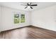 Bright bedroom with wood floors, a window looking out to the yard, and neutral walls at 578 Cedar Avenue, Atlanta, GA 30318
